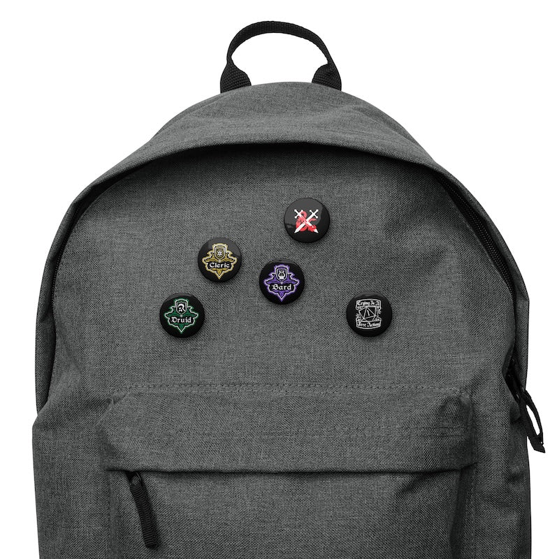 Gray backpack with various pins on a white background