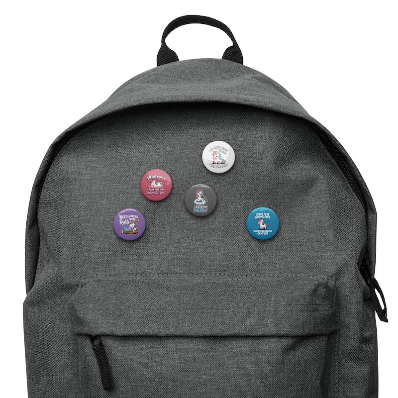 Gray backpack with colorful buttons on a white background
