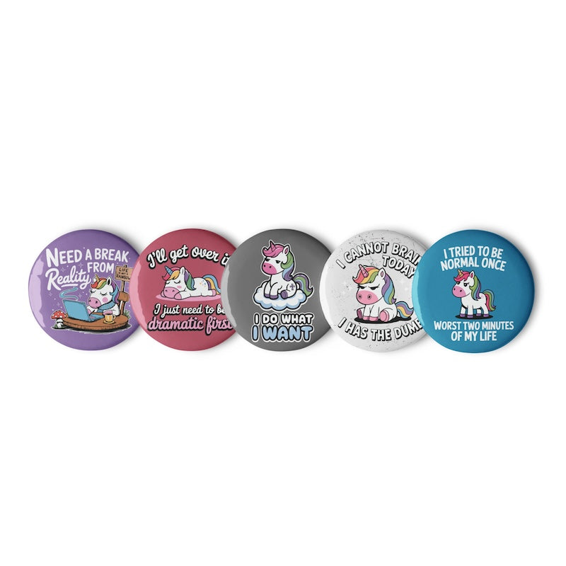 Set of five buttons with unicorn illustrations and humorous text on a white background