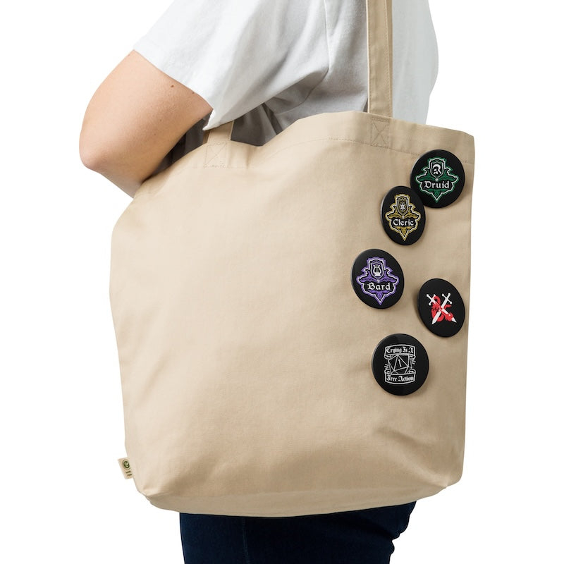 Beige tote bag with decorative buttons on a white background