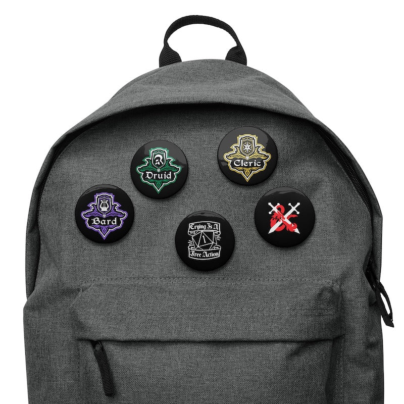 Gray backpack with five character class pins on a white background