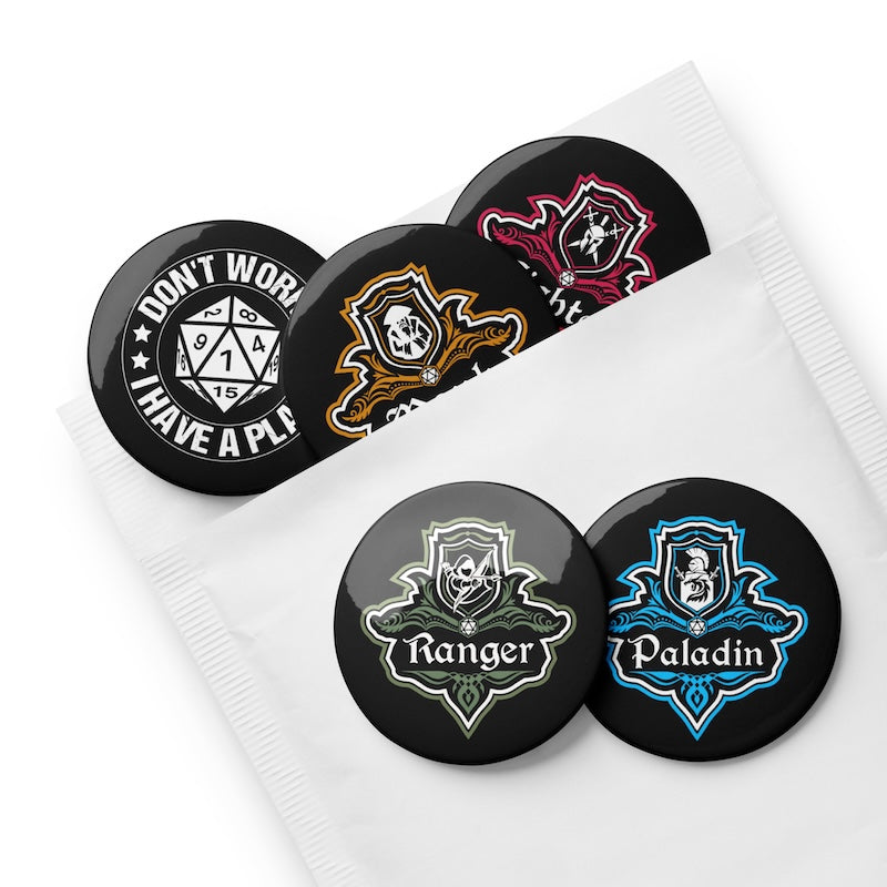 Set of black buttons with various designs and text on a white background