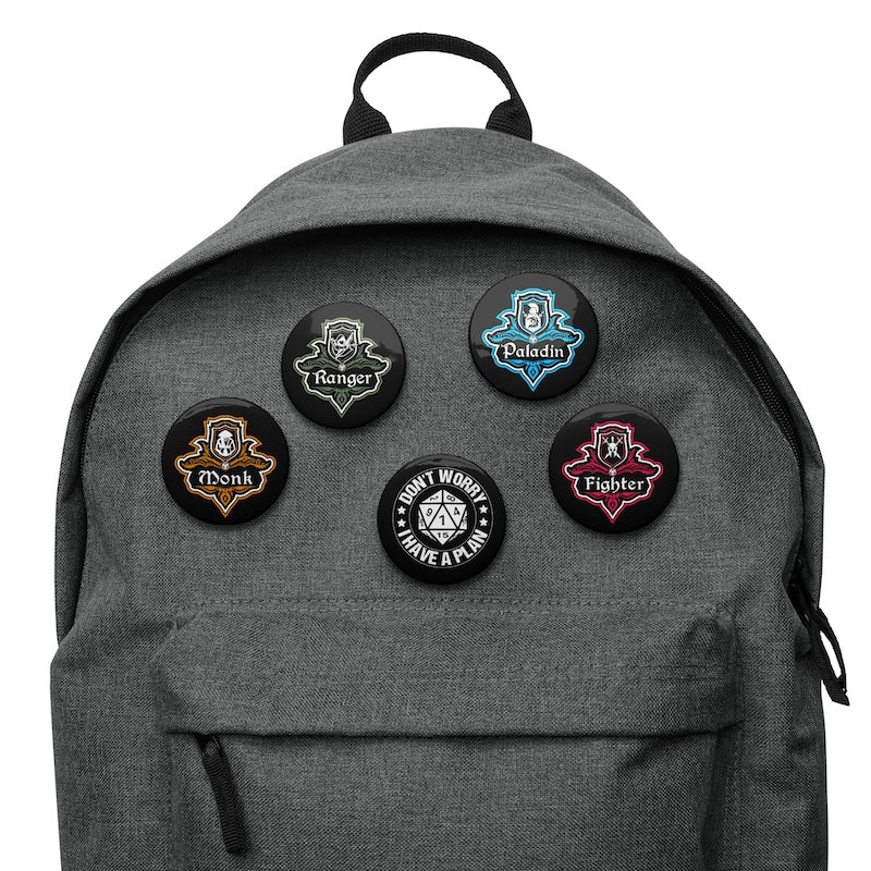 Gray backpack with six character class patches on a white background