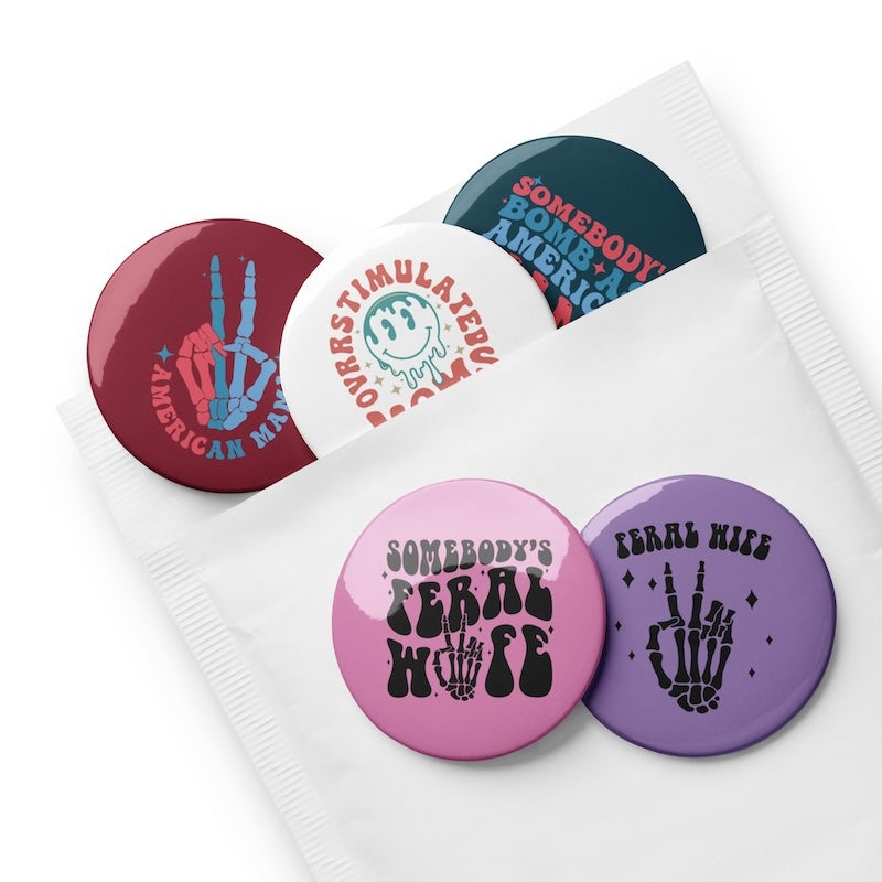 Set of colorful buttons with various designs on a white background