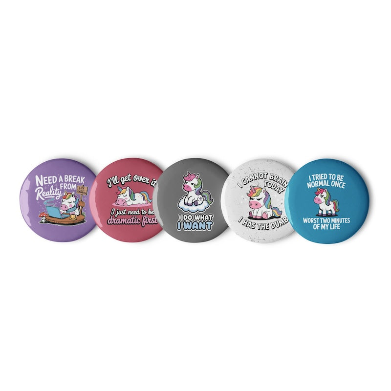 Five colorful buttons with unicorn designs and humorous text on a white background