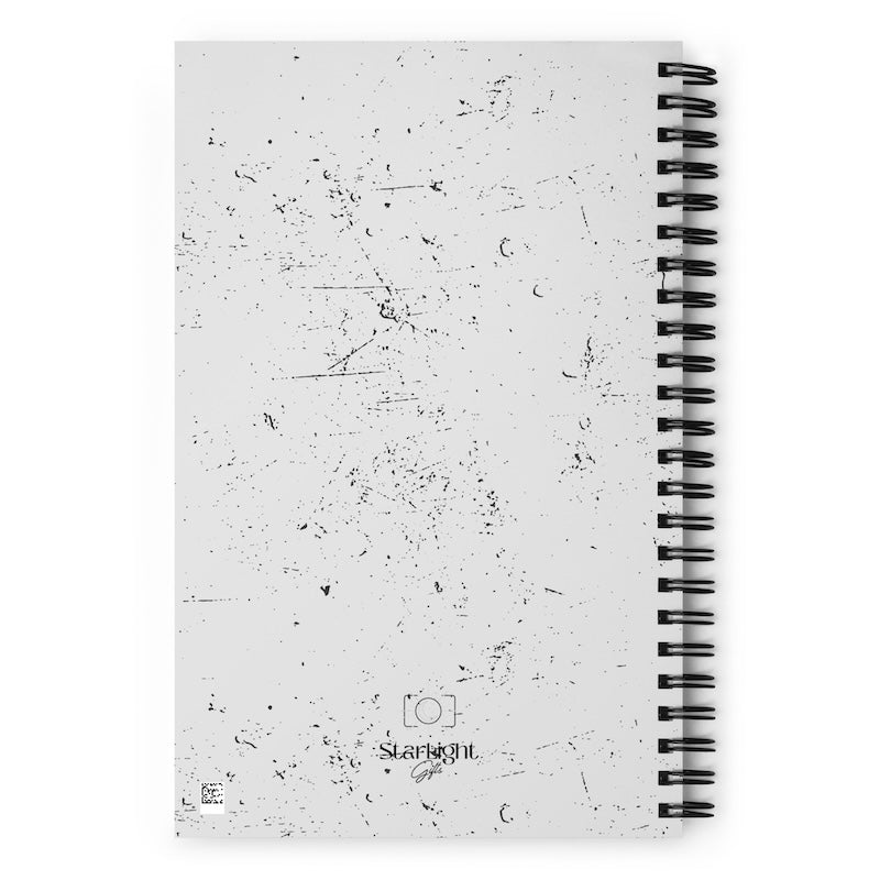 Spiral-bound notebook with textured cover and 'Starlight' branding on a white background