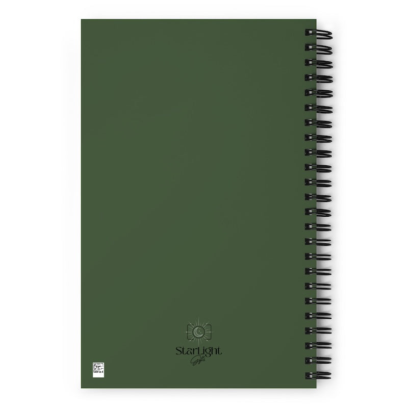 Green notebook with spiral binding on a white background