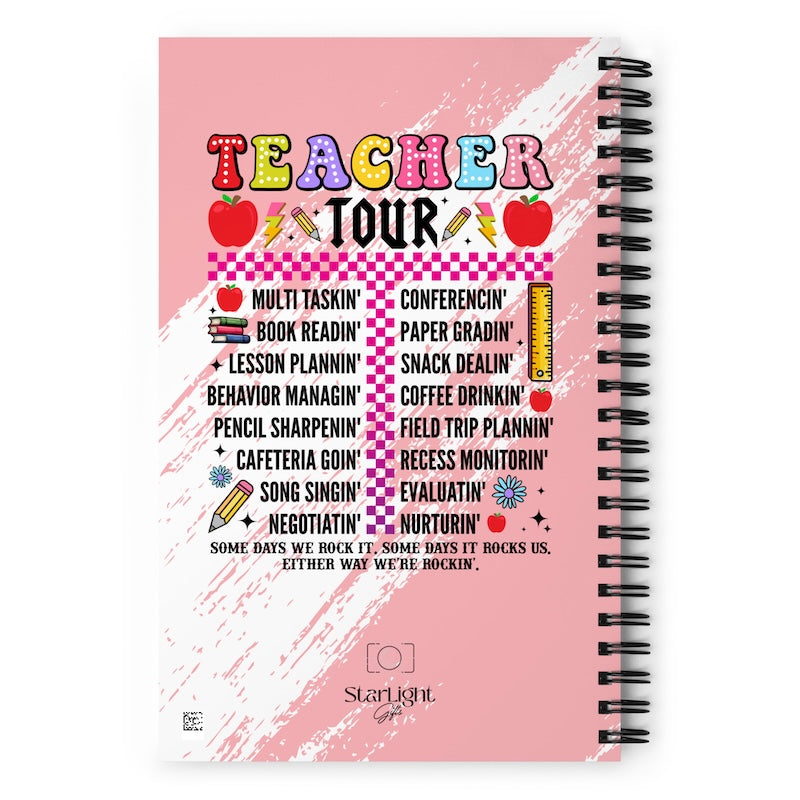 Notebook cover with colorful text and graphics on a pink background
