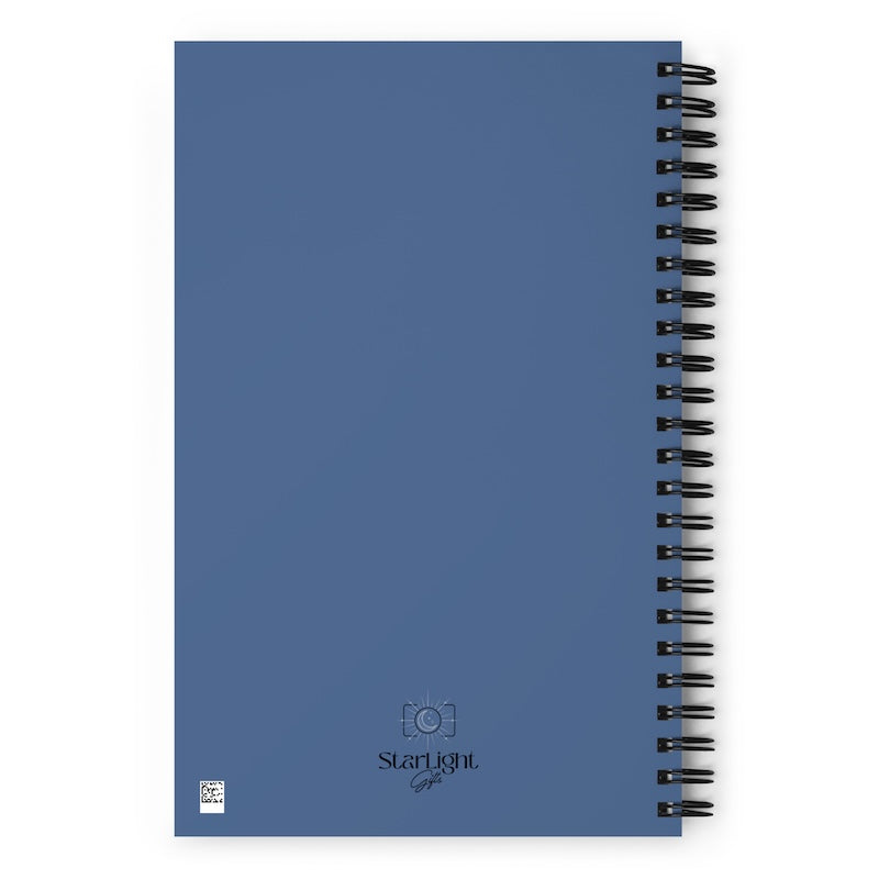 Blue notebook with spiral binding on a white background