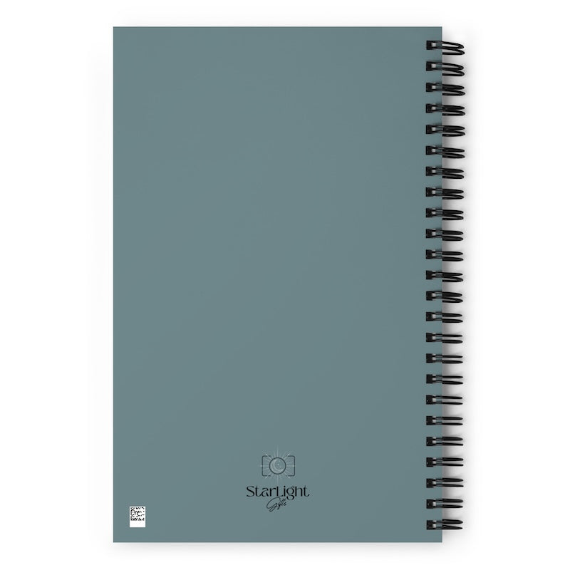 Blue spiral-bound notebook with 'Starlight' branding on a white background