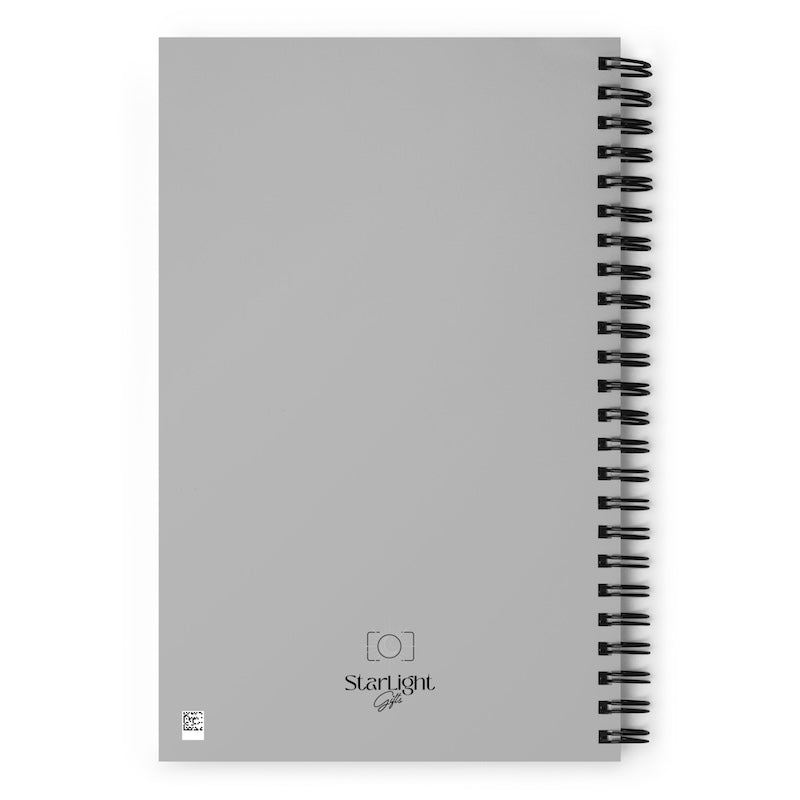 Gray notebook with spiral binding on a white background