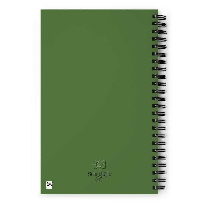 Green notebook with spiral binding on a white background