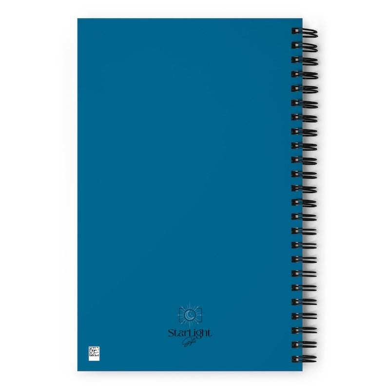 Blue notebook with spiral binding on a white background