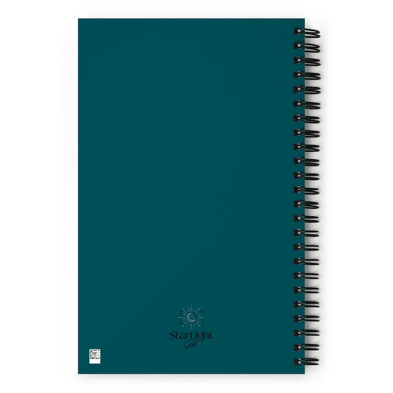 Teal notebook with black spiral binding on a white background