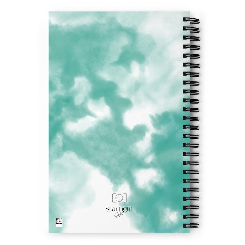Notebook with a cloud pattern cover and 'Starlight' branding.