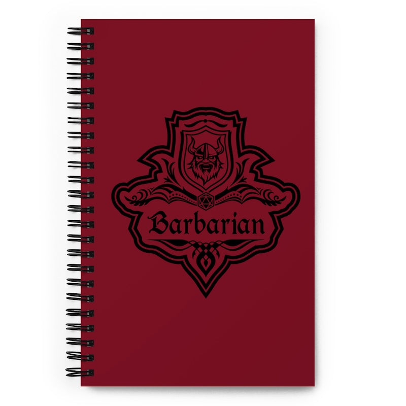 Red notebook with 'Barbarian' design on a white background