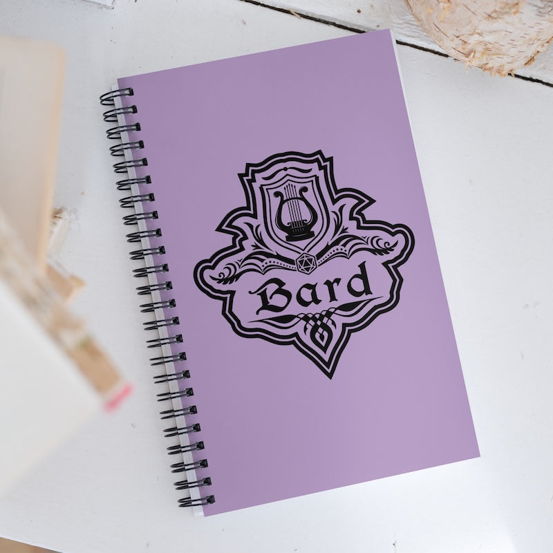 Purple notebook with 'Bard' design on a white surface
