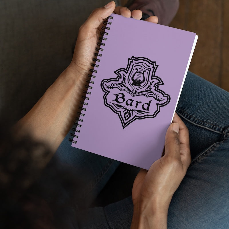 Purple notebook with 'Bard' design held by a person