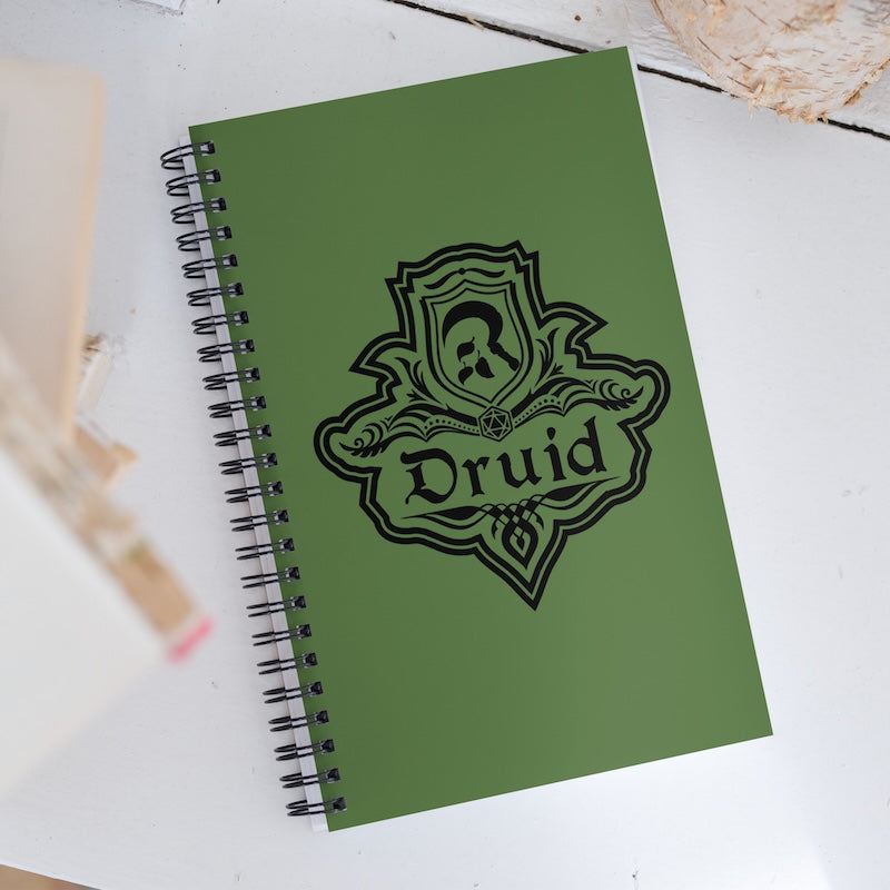 Green notebook with 'Druid' emblem on a white surface