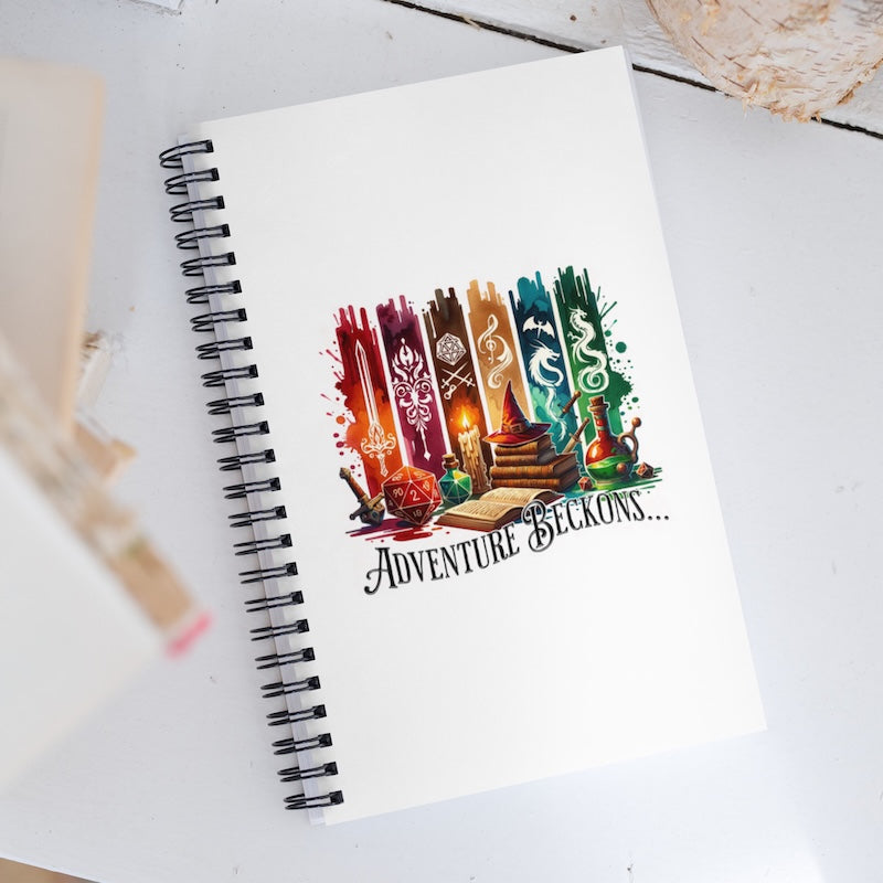 Spiral-bound notebook with a colorful illustration and text on a white surface