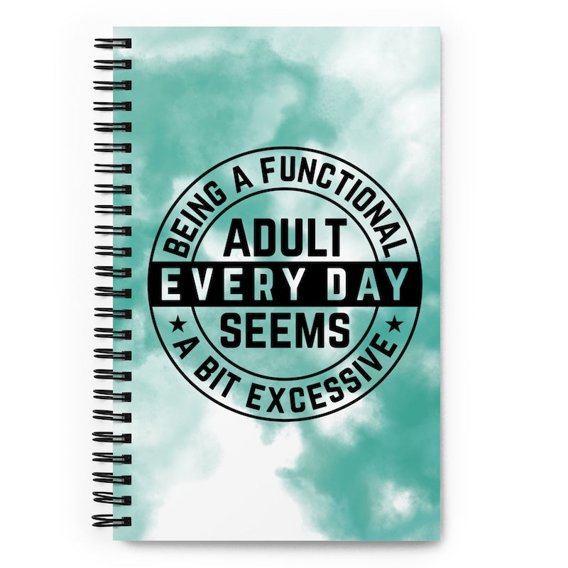 Notebook with a turquoise tie-dye background and text on a white background