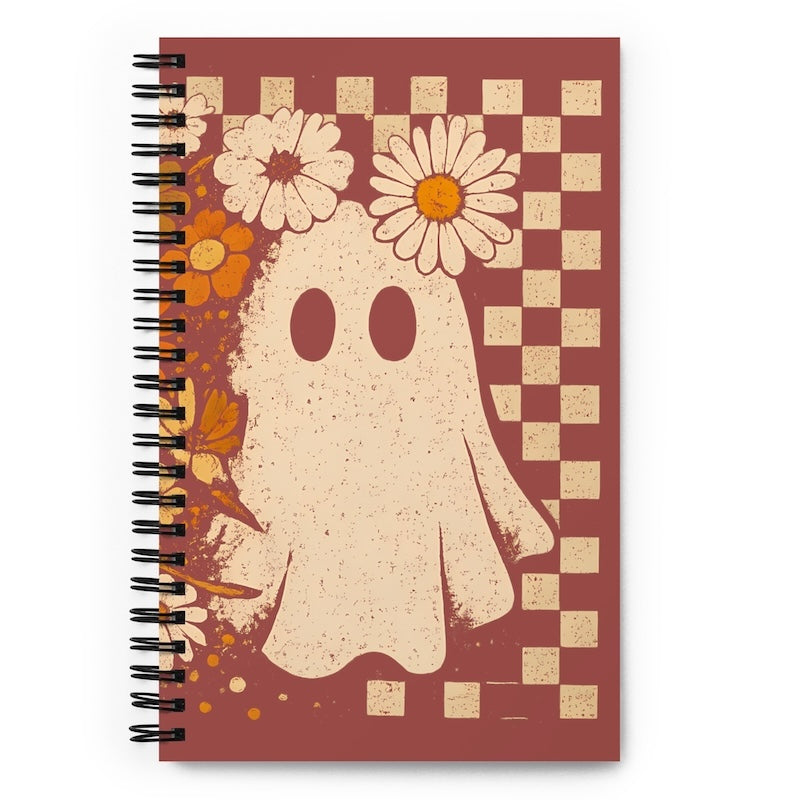 Notebook with a ghost and floral design on a checkered background