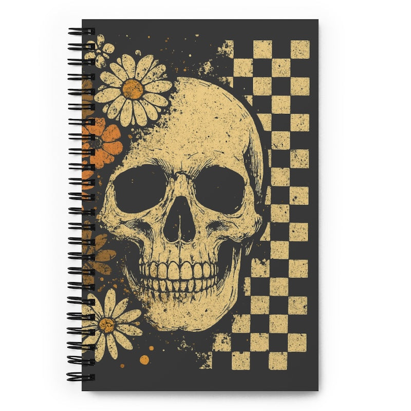 Notebook with a skull and floral design on a checkered background