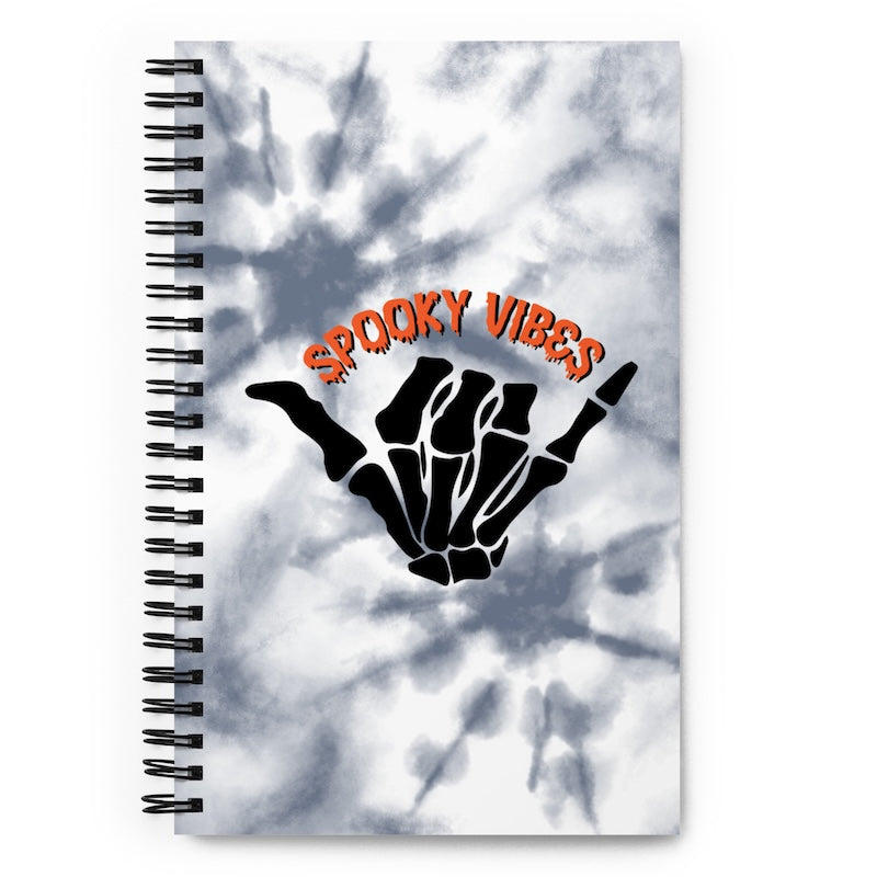 Notebook with 'Spooky Vibes' design on a tie-dye background