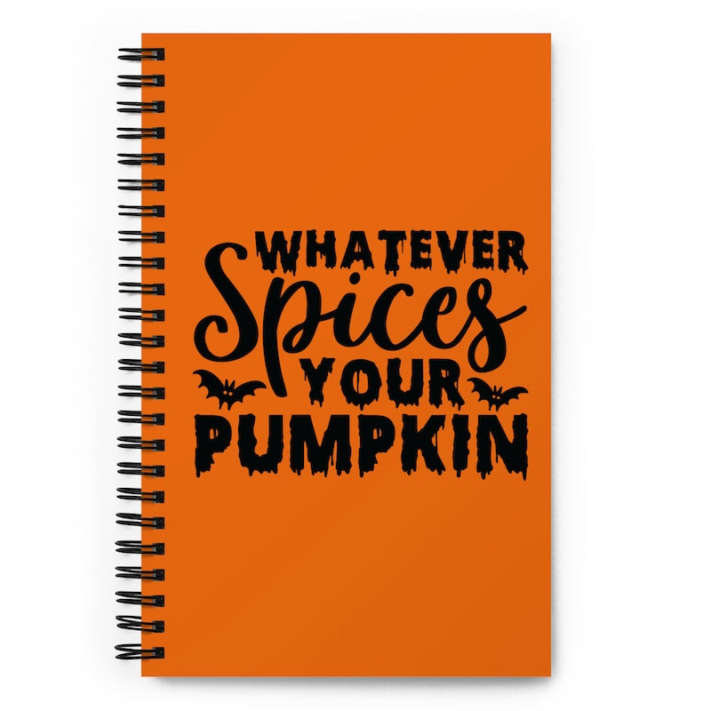Orange notebook with black text 'Whatever Spices Your Pumpkin' on a white background
