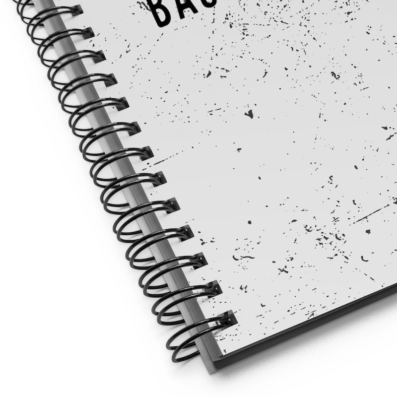 Spiral-bound notebook with textured cover on a white background