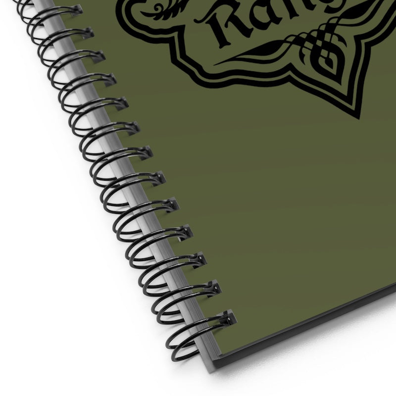 Green notebook with spiral binding and a logo on a white background