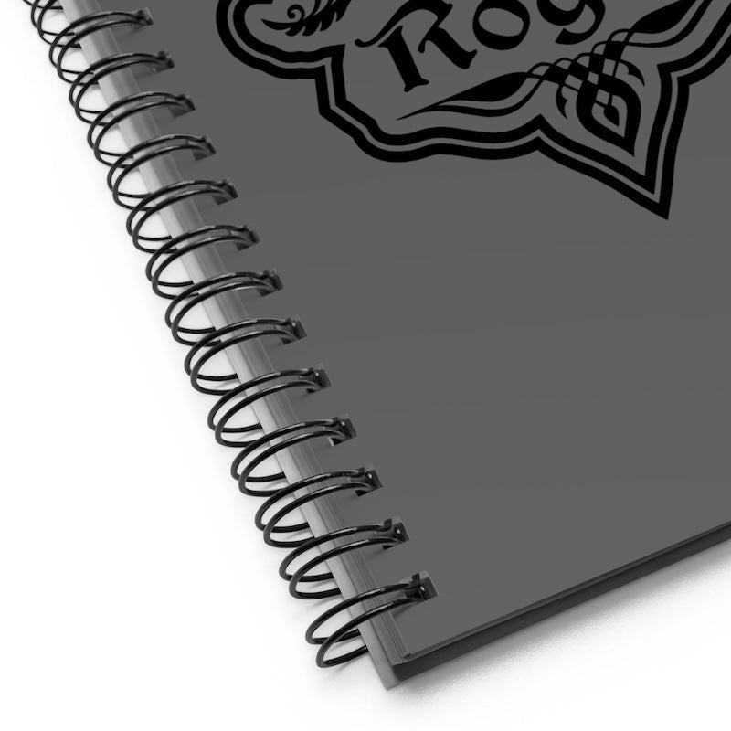 Gray notebook with spiral binding and a logo on a white background