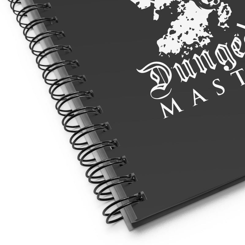 Black notebook with 'Dungeon Master' text and logo on a white background