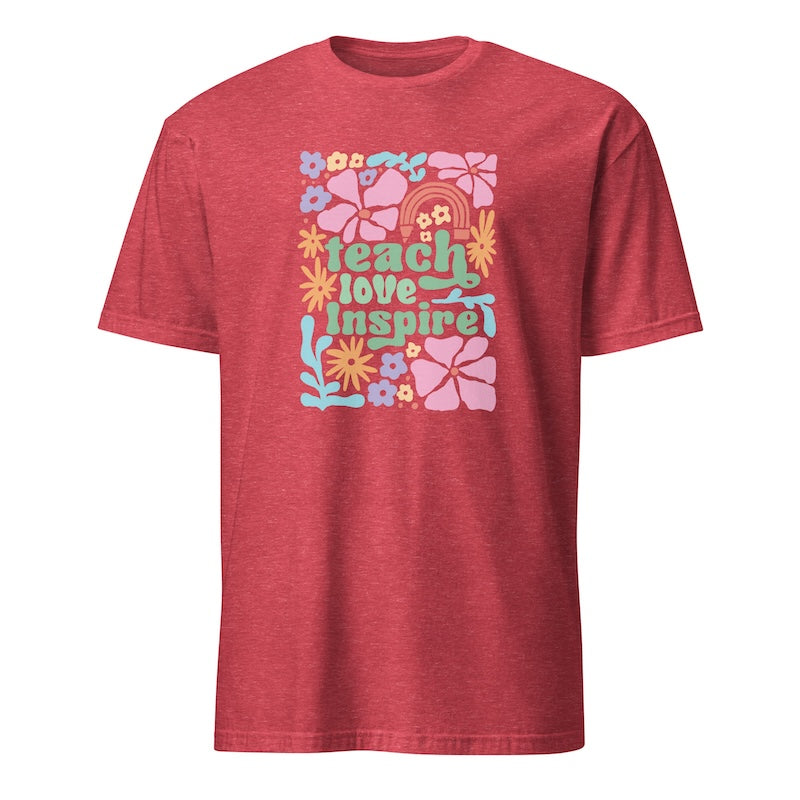 Red t-shirt with colorful graphic and text 'teach love inspire' on a white background