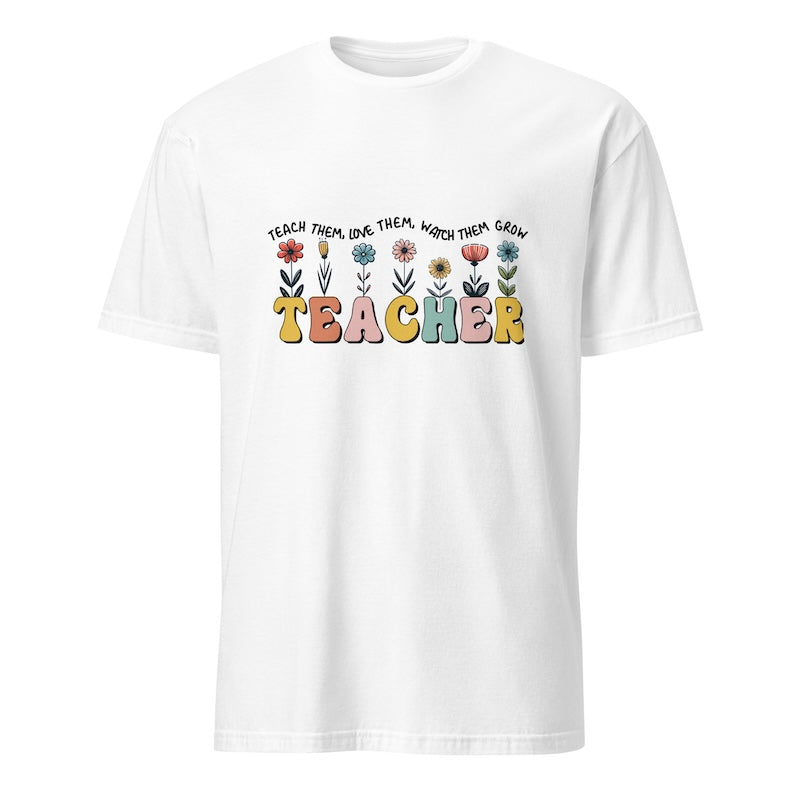 White t-shirt with colorful 'TEACHER' text and floral design on a white background