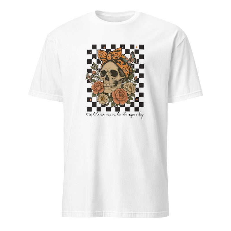 White t-shirt with a skull and floral design on a checkered background