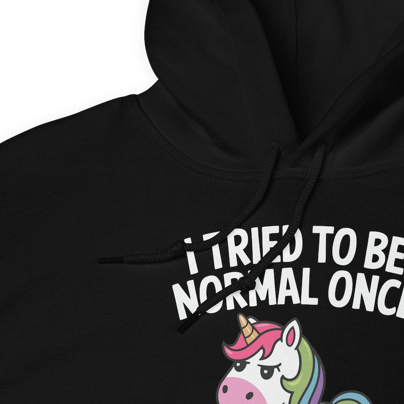Black hoodie with a unicorn graphic and text on a white background