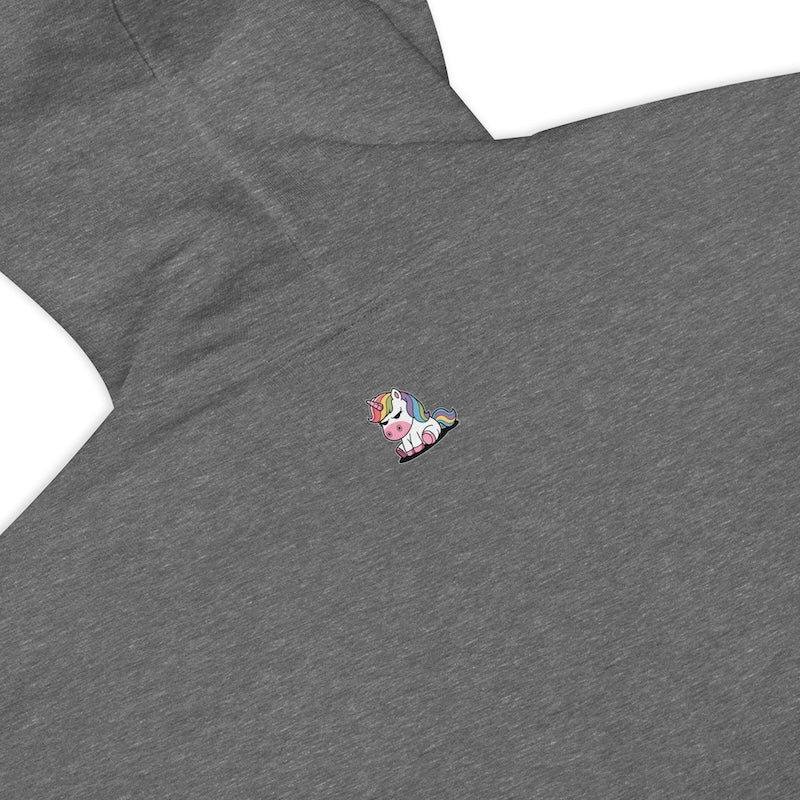 Gray shirt with a colorful unicorn pin on a white background