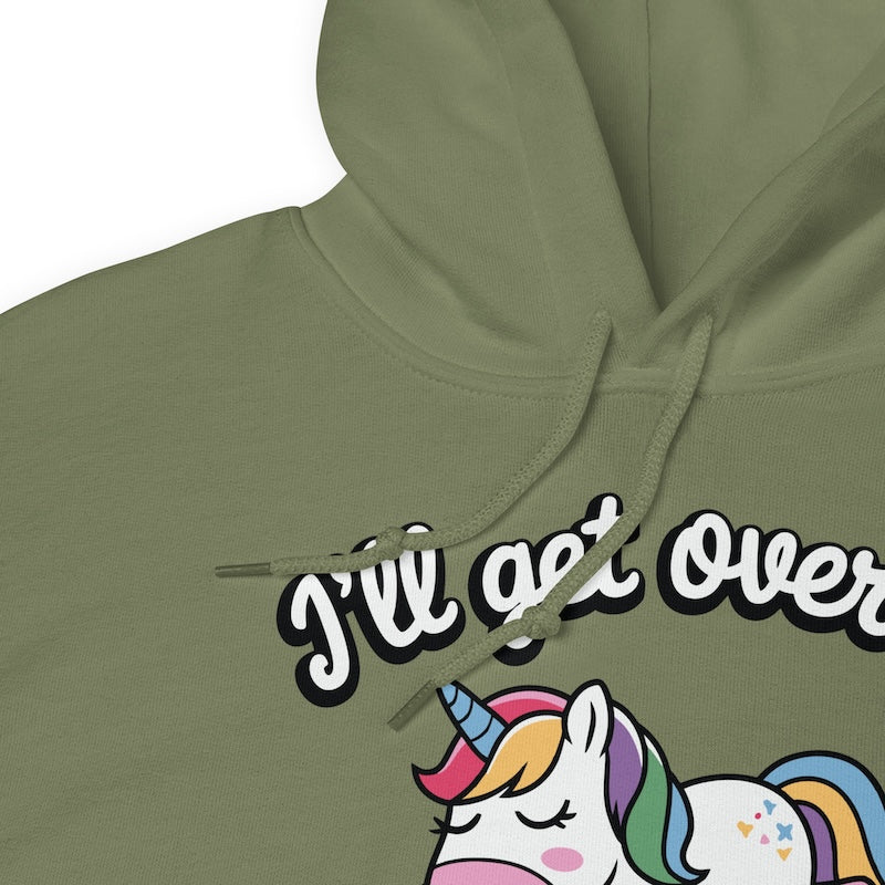 Green hoodie with a unicorn graphic and text 'I'll get over it' on a white background