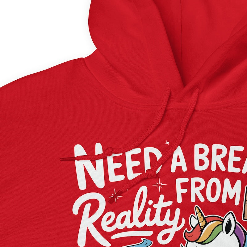 Red hoodie with text 'NEED A BREAK FROM Reality' and a unicorn graphic on a white background