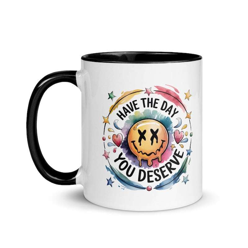 Mug with smiley face and motivational quote on a white background