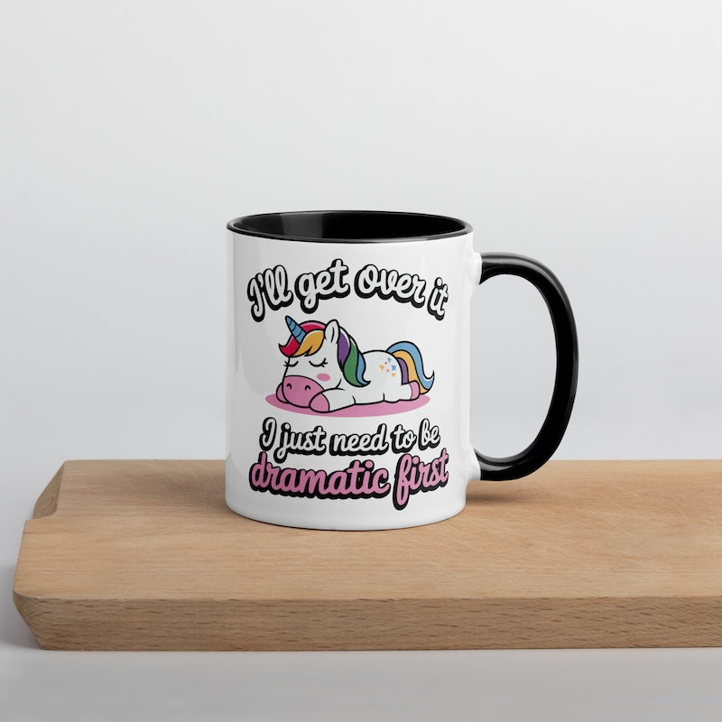 Mug with unicorn design and text on a wooden surface