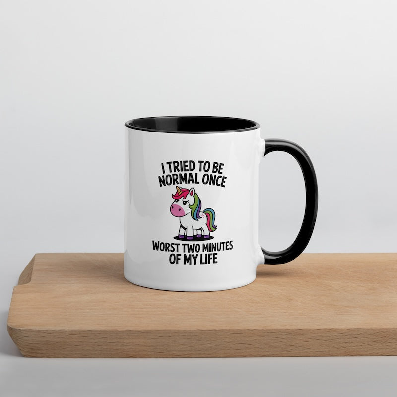 Mug with unicorn design and text on a wooden surface