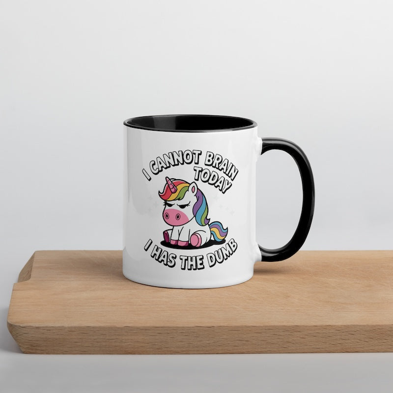 Mug with unicorn design and text on a wooden surface