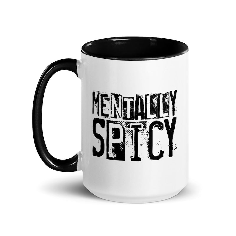 White mug with black interior and handle, featuring the text 'MENTALLY SPICY' in black.