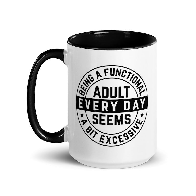 White mug with black interior and handle, featuring a humorous text design.