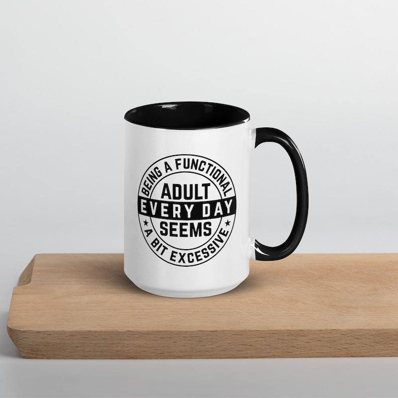 White mug with black handle featuring a humorous quote on a wooden surface.