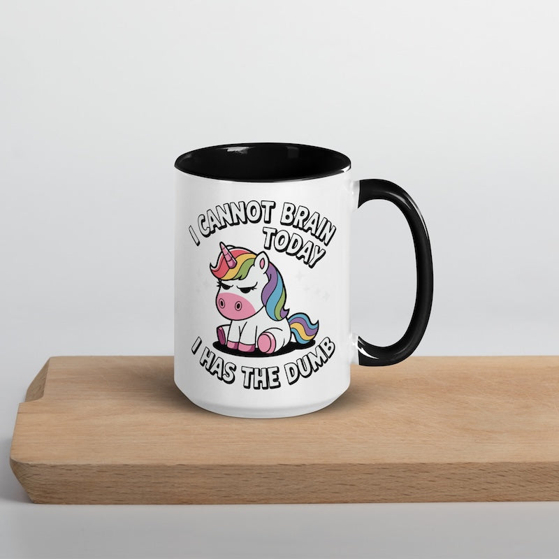 Mug with unicorn design and text on a wooden surface