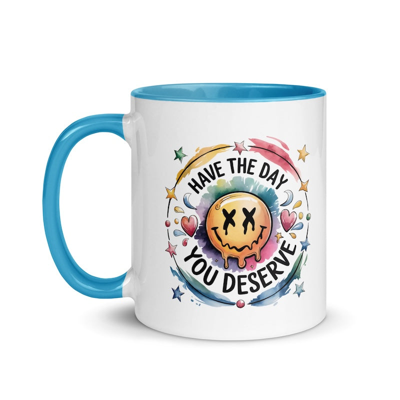 Mug with smiley face and motivational quote on a white background