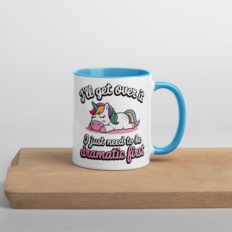 Mug with unicorn design and text on a wooden surface